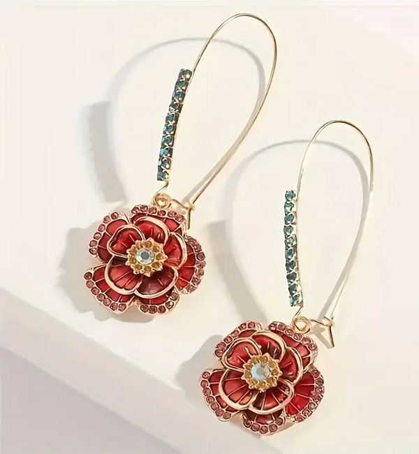 Gold drop earrings with red flower charms and blue gemstones