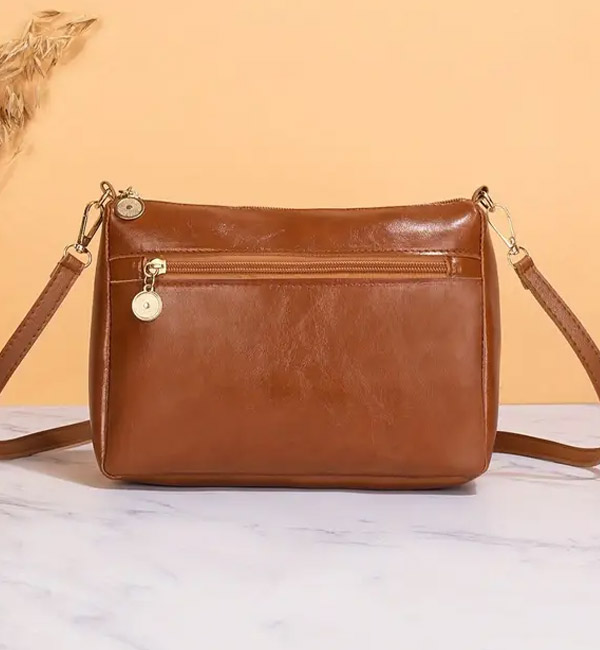 Simple brown leather crossbody bag with zipper