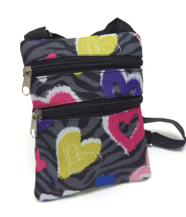 Zebra and heart print messenger bag