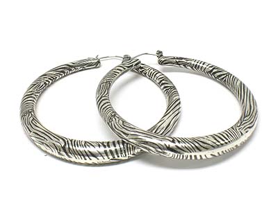 Large enamel covered animal pattern hoop earring  - hoops