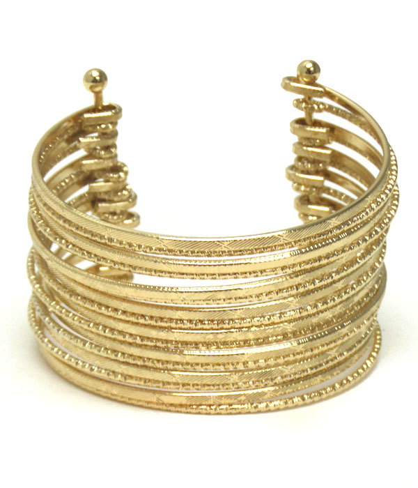 Multi textured metal wire bangle bracelet