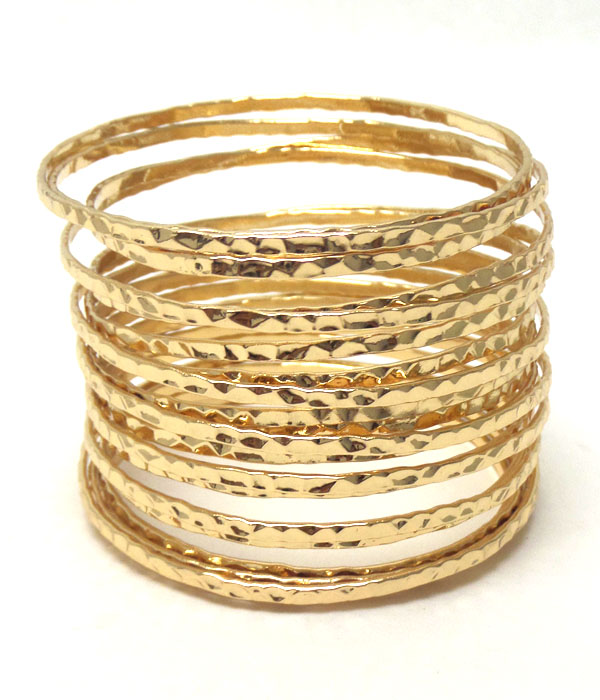 Tall coiled metal bangle