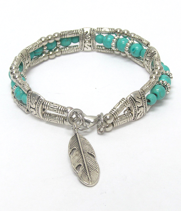 Feather charm and turquoise ball bracelet