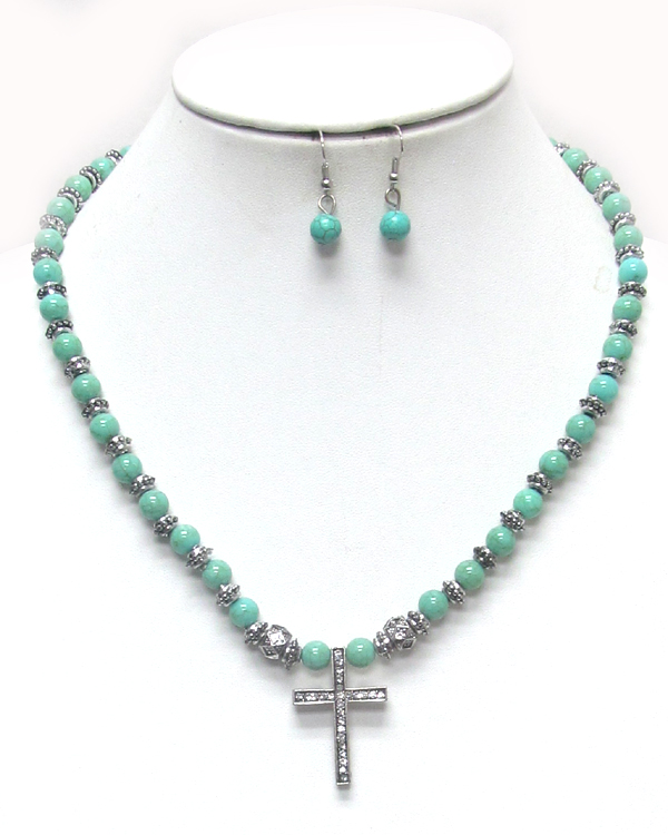 Turquoise and crystal cross pendant necklace