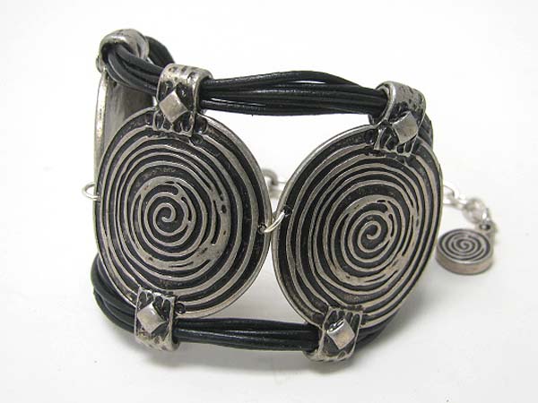 Spiral textured metal disk and leather cord link bracelet