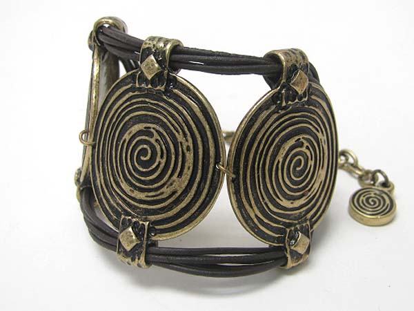 Spiral textured metal disk and leather cord link bracelet
