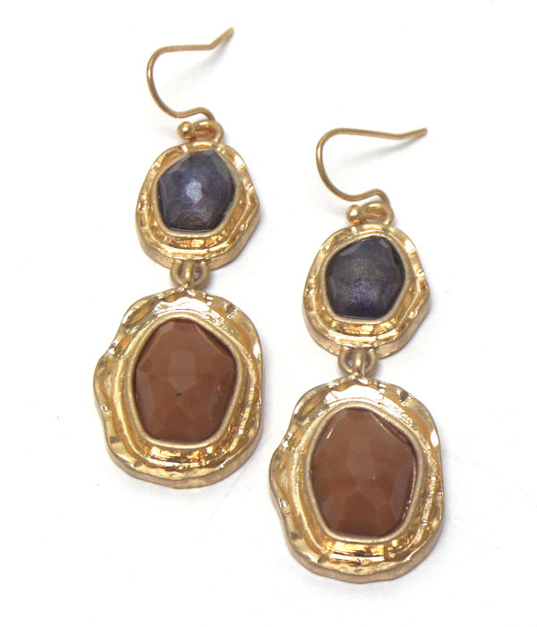 Linked stones with worn gold hook earrings 