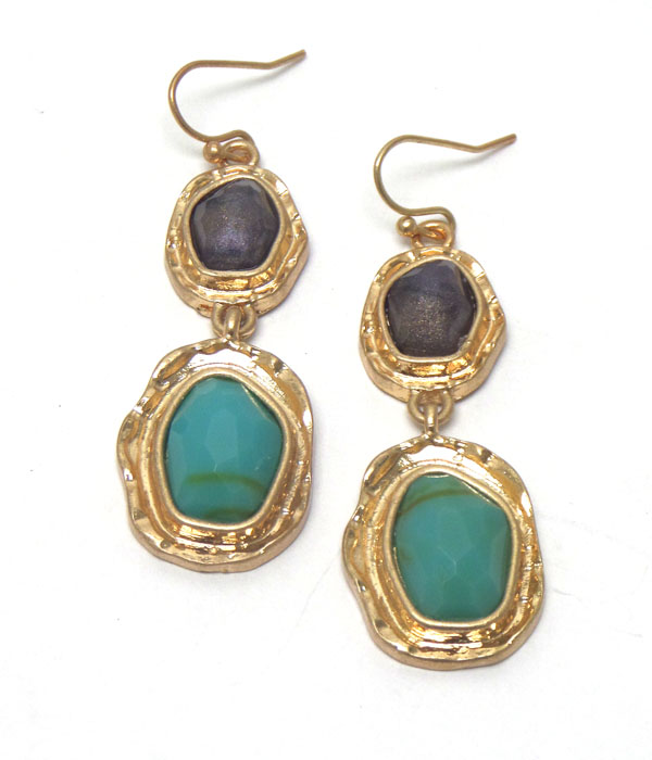 Linked stones with worn gold hook earrings 
