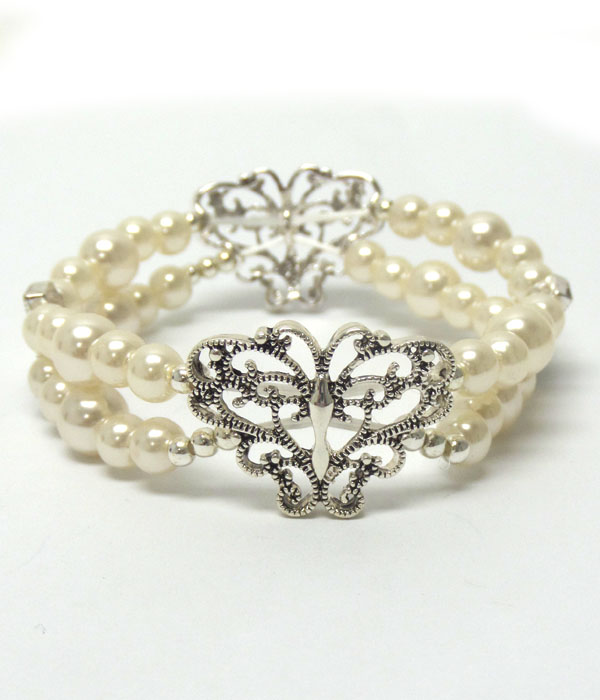 Metal filigree butterfly and double stretch pearl bracelet