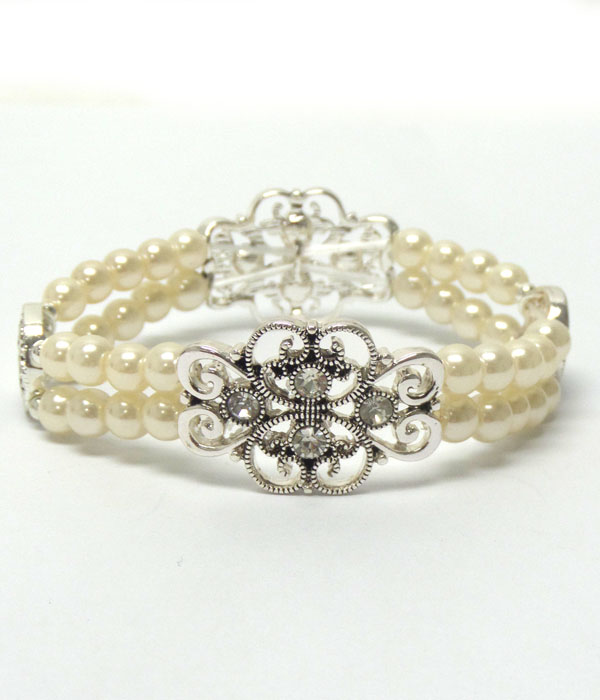 Crystal and metal filigree and double stretch pearl bracelet