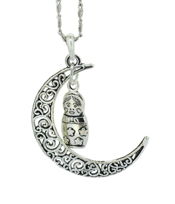 Metal filigree moon and nesting doll pendant necklace