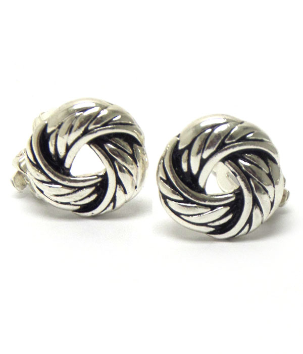 Textured metal knot clip on earrings