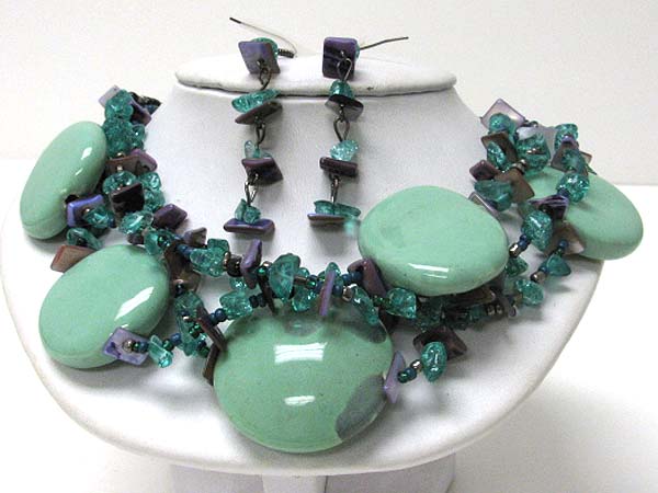 Multi figurine disk and chip stone necklace earring set