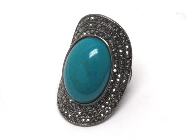 Crystal and puffy stone long finger stretch ring