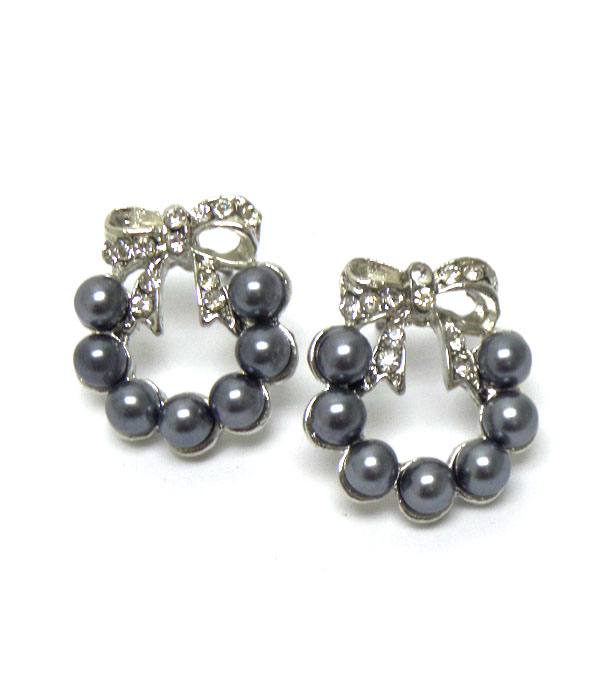 Metal ribbon with pearl earring