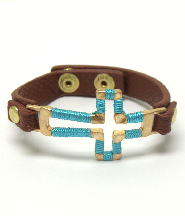 Metal cross with leather band button bracelet