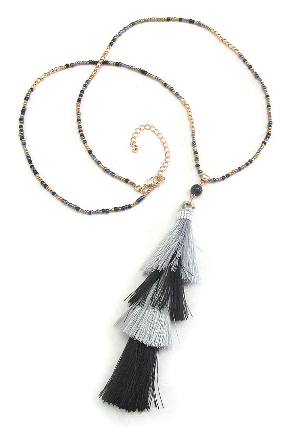 Multi layer thread tassel and seed bead long necklace