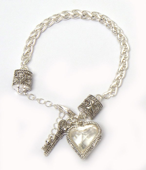 Glass and metal casting heart and key charm bracelet