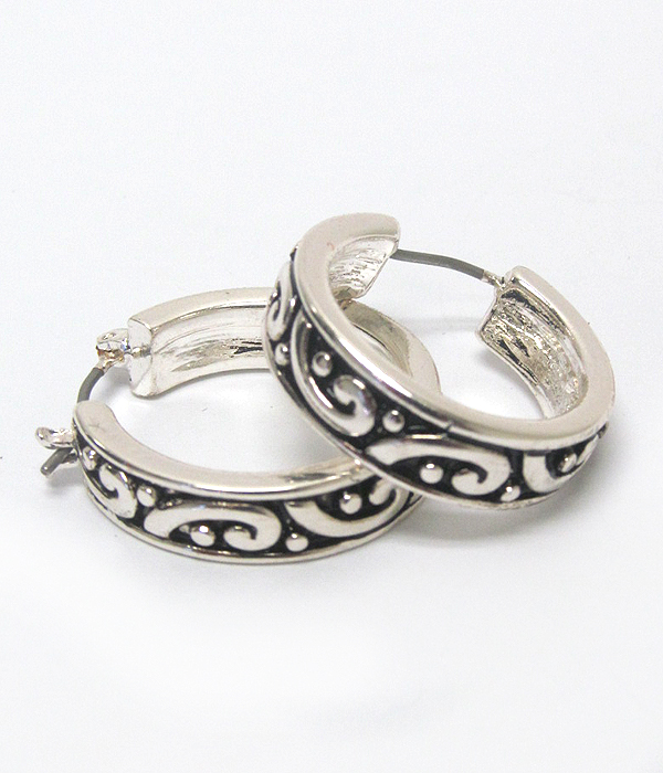 Filigree metal hoop earring