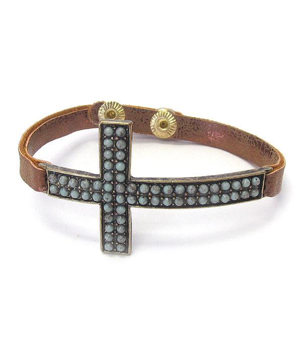 Crystal stud cross and leather band bracelet