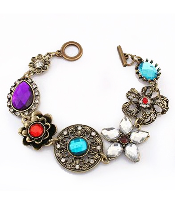 Metal filigree and crystal flower link toggle bracelet