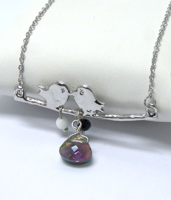 Pair of birds with stone necklace