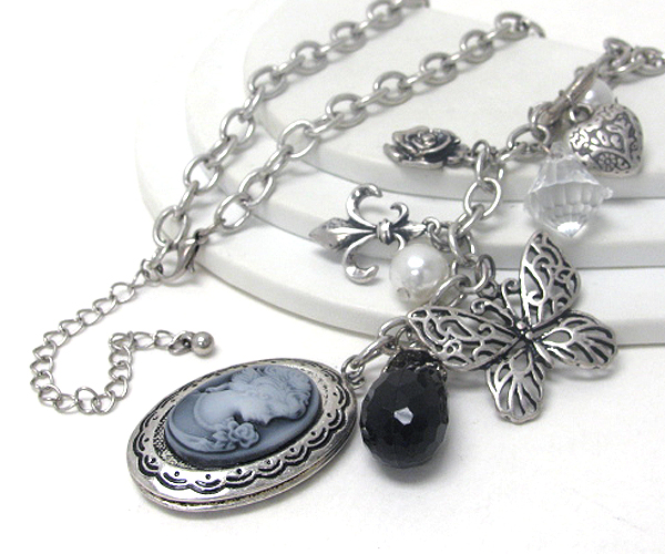 Cameo pendant and multi metal filigree charm necklace