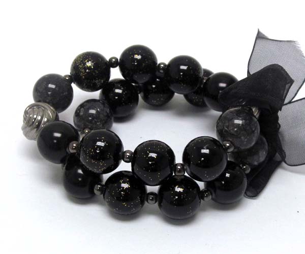 Ribbon tied multi pearl beads and metal ball with coated ball stretch bracelet