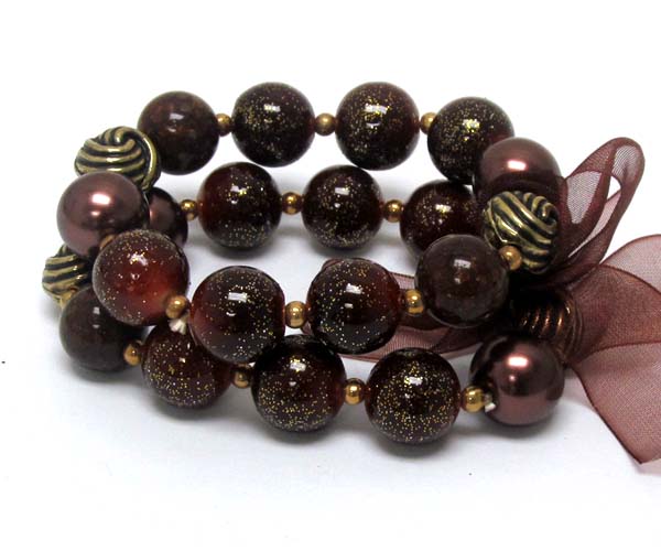 Ribbon tied multi pearl beads and metal ball with coated ball stretch bracelet