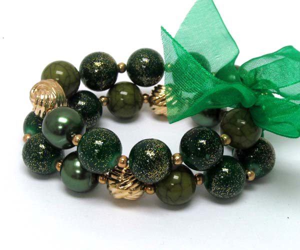 Ribbon tied multi pearl beads and metal ball with coated ball stretch bracelet