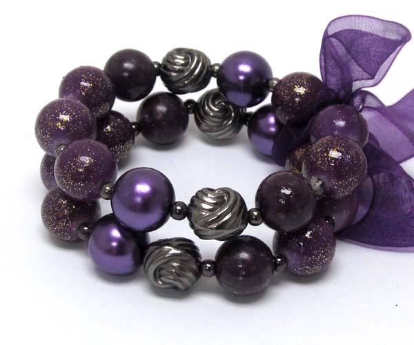 Ribbon tied multi pearl beads and metal ball with coated ball stretch bracelet