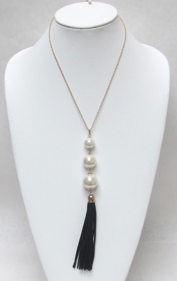 Multi layer linked pearls with tassel drop necklace