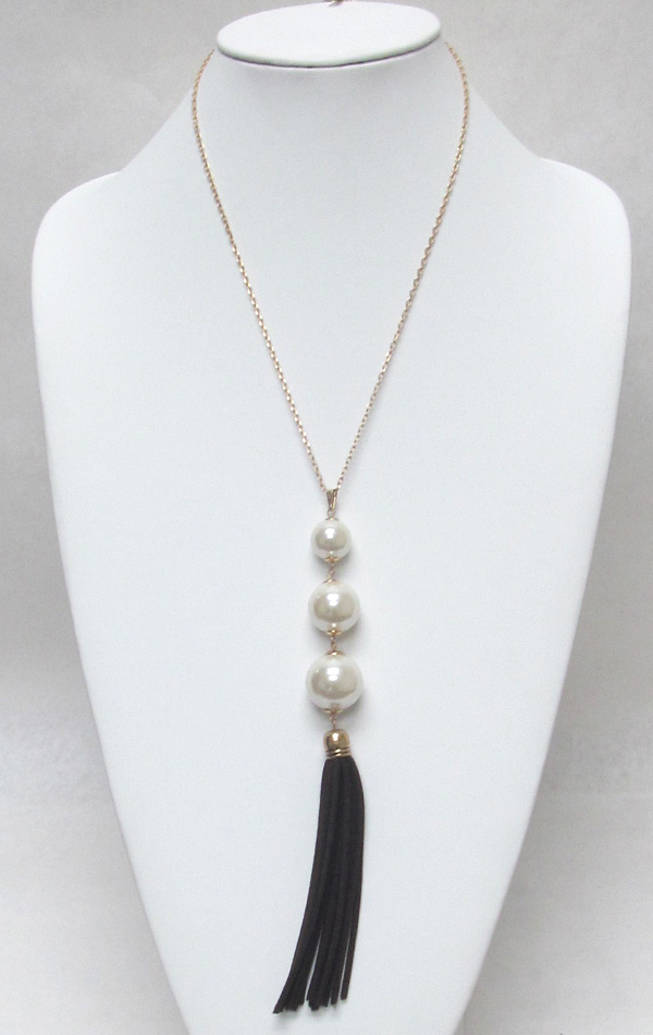 Multi layer linked pearls with tassel drop necklace