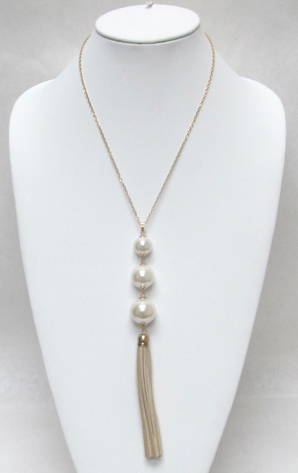 Multi layer linked pearls with tassel drop necklace