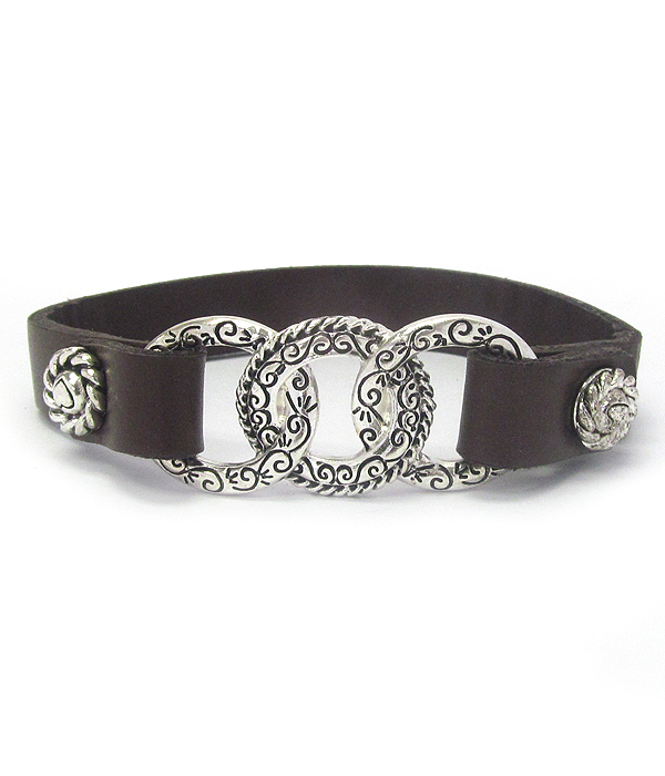 Designer textured triple ring and snap on leather bracelet