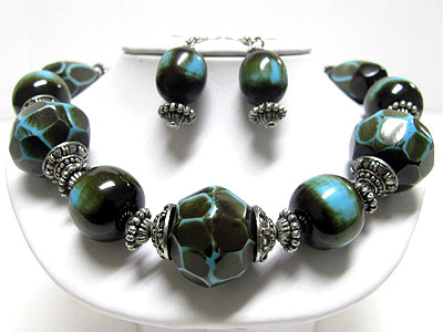 Carved stone ball and antique metal necklace set