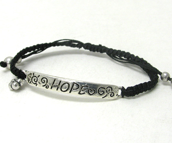 Message plate and braided cord bracelet