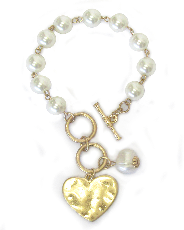 Hammered disk and pearl toggle bracelet