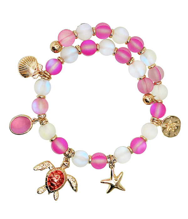 Sealife theme multi charm and ball bead coil bracelet - turtle starfish