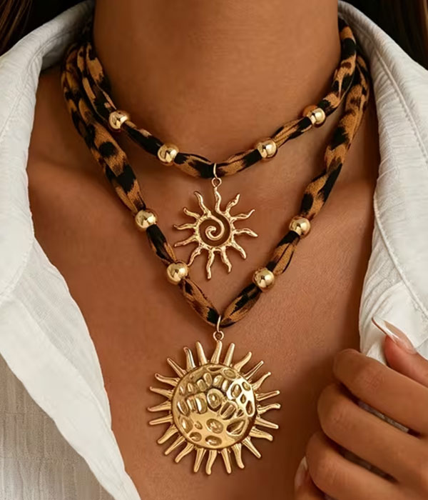 Leopard fabric and sunburst pendant 2 piece necklace set