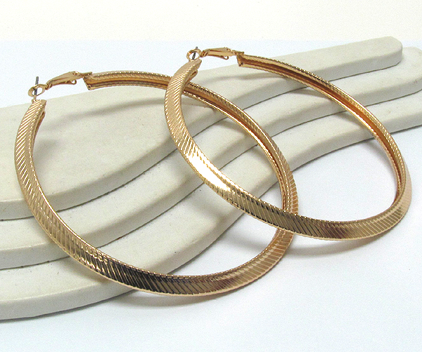 Metal textured large hoop  earring  - hoops