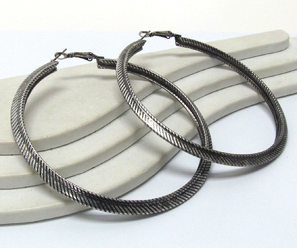 Metal textured large hoop  earring  - hoops